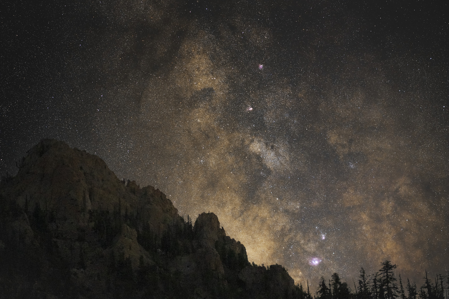 The Milky Way core captured on a backpacking trip in Utah, showing dust lanes and golden core color.