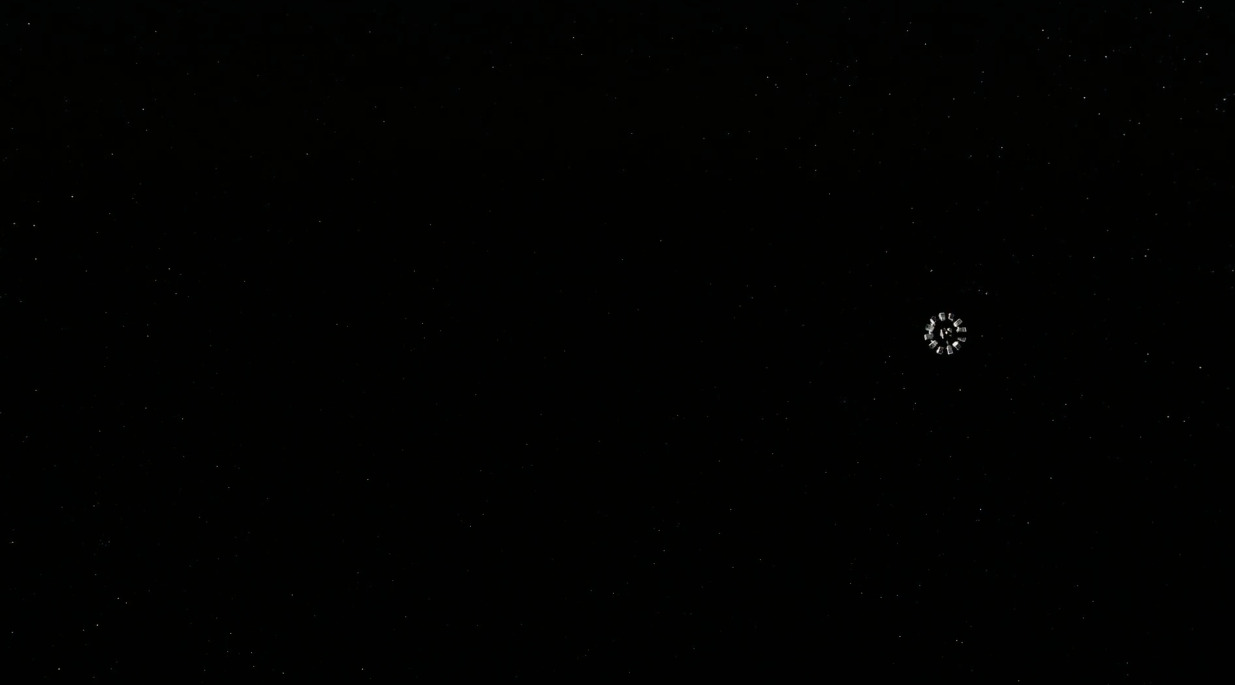 A still from Interstellar showing space rendered as nearly empty and black behind the spacecraft.